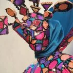 Maschera Arlecchino in stile veneziano al Carnevale dei figli di Bocco