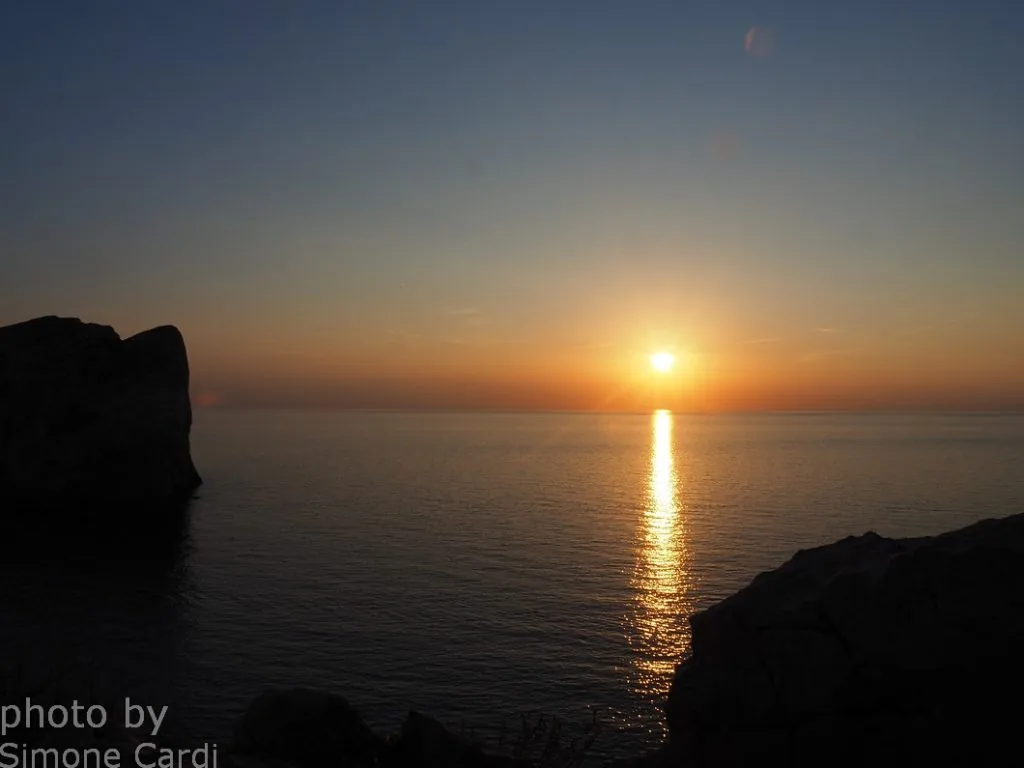 Capo Caccia Alghero Sardegna: foto sole rosso al tramonto
