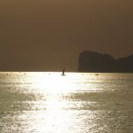 Tramonto Capo Caccia Alghero barca nel sole